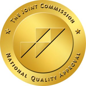 A gold circular badge with the text 